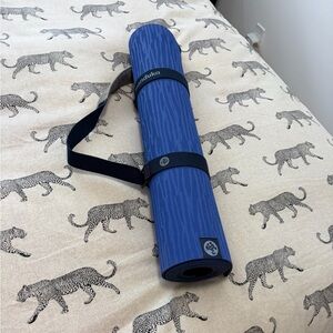 manduka royal blue textured yoga mat with logo